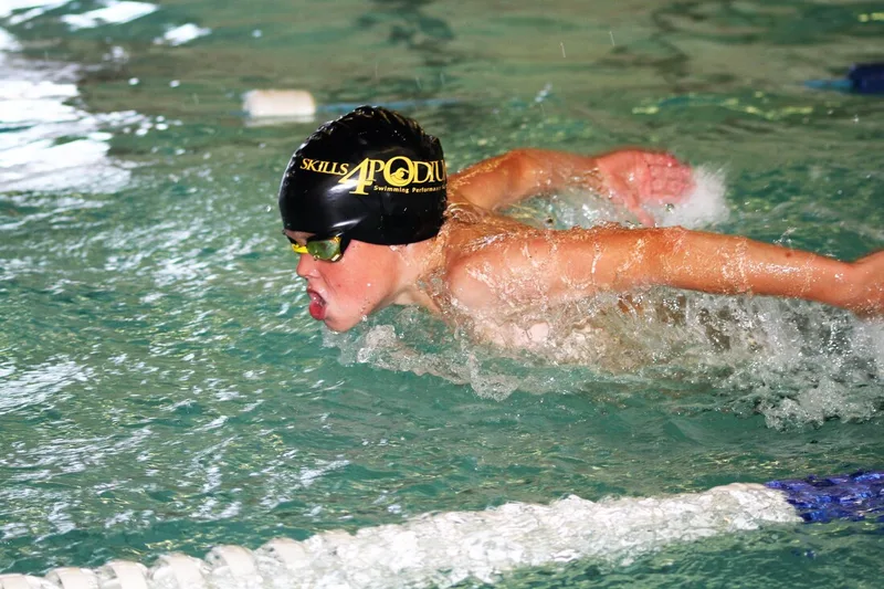 Competitive swimmers practicing stroke technique drills during a Skills4Podium master class.